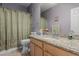 Bathroom with granite vanity and updated fixtures at 26249 N 68Th Ln, Peoria, AZ 85383