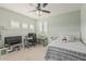 Bright bedroom with neutral colors, ceiling fan, and comfortable bed at 26249 N 68Th Ln, Peoria, AZ 85383