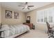 Cozy bedroom with neutral tones, natural light, and comfortable bed at 26249 N 68Th Ln, Peoria, AZ 85383