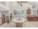 Bright breakfast nook with granite table, shuttered window, and tile flooring at 26249 N 68Th Ln, Peoria, AZ 85383