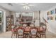 Elegant dining room with a large table, decorative chairs, and tile flooring at 26249 N 68Th Ln, Peoria, AZ 85383