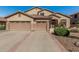 Charming single-story home features a tile roof and a spacious three-car garage at 26249 N 68Th Ln, Peoria, AZ 85383