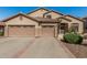 Charming single-story home features a tile roof and a spacious three-car garage at 26249 N 68Th Ln, Peoria, AZ 85383