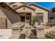 Inviting front entry with decorative tile work and beautiful stone accents at 26249 N 68Th Ln, Peoria, AZ 85383