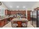 Stylish kitchen featuring granite countertops, stainless steel appliances, and custom cabinetry at 26249 N 68Th Ln, Peoria, AZ 85383