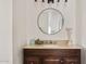 Bathroom featuring a round mirror above a wood vanity with a granite countertop at 2650 W Union Hills Dr # 100, Phoenix, AZ 85027