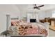 Bright bedroom featuring a decorative white frame bed and a unique patchwork quilt at 2650 W Union Hills Dr # 100, Phoenix, AZ 85027