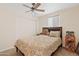 Cozy bedroom featuring a ceiling fan, carpeted floors, and a window for natural light at 2650 W Union Hills Dr # 100, Phoenix, AZ 85027