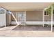 Spacious carport featuring concrete flooring, metal canopy, and convenient side door access at 2650 W Union Hills Dr # 100, Phoenix, AZ 85027