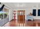 Bright living room featuring hardwood floors, a front door and sliding glass door to a porch at 2650 W Union Hills Dr # 100, Phoenix, AZ 85027