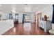 Spacious living room with hardwood floors, large windows, and a view of front porch at 2650 W Union Hills Dr # 100, Phoenix, AZ 85027