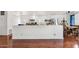 Open-concept view of the living room showing a breakfast bar and contemporary appliances at 2650 W Union Hills Dr # 100, Phoenix, AZ 85027