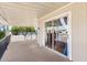 Open porch with black railing, covered awning, and sliding glass door leading to the interior at 2650 W Union Hills Dr # 100, Phoenix, AZ 85027