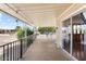 Relaxing covered porch with railing and view of the street, offering a pleasant outdoor space at 2650 W Union Hills Dr # 100, Phoenix, AZ 85027