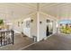 Inviting covered porch featuring double-door entry, stylish decor, and covered awning at 2650 W Union Hills Dr # 100, Phoenix, AZ 85027