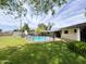 Spacious backyard featuring a refreshing pool with slide and secure safety fence for Gathering enjoyment at 2749 S Rita Ln, Tempe, AZ 85282