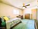 Cozy bedroom featuring a comfortable bed, ceiling fan, and bright window at 2749 S Rita Ln, Tempe, AZ 85282