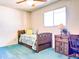 Cozy bedroom features a twin bed and a functional wood desk at 2749 S Rita Ln, Tempe, AZ 85282