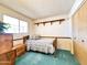 A comfortable twin bedroom features wood accents and built-in storage at 2749 S Rita Ln, Tempe, AZ 85282
