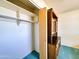 Spacious closet with built-in shelves and hanging rod, providing ample storage space at 2749 S Rita Ln, Tempe, AZ 85282