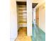 Hallway with large storage closet and alternating floor coverings at 2749 S Rita Ln, Tempe, AZ 85282