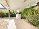 Covered patio area featuring decorative pillars and lush landscaping at 2749 S Rita Ln, Tempe, AZ 85282