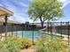 Backyard pool with slide surrounded by secure fencing at 2749 S Rita Ln, Tempe, AZ 85282