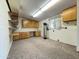 Functional utility room with ample storage cabinets and counter space at 2749 S Rita Ln, Tempe, AZ 85282