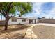 The backyard has a walking path, gravel landscaping and a back patio at 2914 W Marlette Ave, Phoenix, AZ 85017