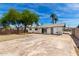 The rear exterior with slider has a large concrete patio and gravel landscaping at 2914 W Marlette Ave, Phoenix, AZ 85017