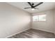 Neutral bedroom with natural light, fan, and plank flooring at 2914 W Marlette Ave, Phoenix, AZ 85017