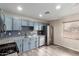 Kitchen features stainless steel appliances, subway tile backsplash, granite countertops, and painted cabinets at 2914 W Marlette Ave, Phoenix, AZ 85017
