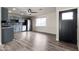 Open concept kitchen with stainless steel appliances, and tile backsplash, blending seamlessly with the living area at 2914 W Marlette Ave, Phoenix, AZ 85017