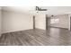 Large living room with wood-look floors, ceiling fan, and neutral wall paint at 2914 W Marlette Ave, Phoenix, AZ 85017