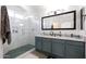 Updated bathroom features a large vanity with double sinks, a glass enclosed shower, and granite countertops at 31227 N 45Th St, Cave Creek, AZ 85331