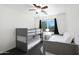 Bedroom with carpet, a bunkbed, a full bed, and bright window with green scenery at 31227 N 45Th St, Cave Creek, AZ 85331