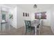Bright dining room features tile floors, a charming table with colorfully painted chairs, and views to the backyard at 31227 N 45Th St, Cave Creek, AZ 85331