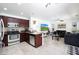 Open-concept kitchen flows into the living area with stainless steel appliances and granite countertops at 31227 N 45Th St, Cave Creek, AZ 85331