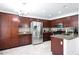 Spacious kitchen features dark wood cabinetry, stainless steel appliances, and ample counter space at 31227 N 45Th St, Cave Creek, AZ 85331