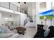 Bright open-concept living area boasts soaring ceilings, iron railing, and a staircase at 31227 N 45Th St, Cave Creek, AZ 85331