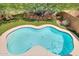 Inviting pool features cool, clear water, well manicured lawn, and mature landscaping at 31227 N 45Th St, Cave Creek, AZ 85331