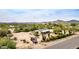 Aerial view of a tan single story home with a large lot, and a red pickup truck parked in front at 33852 N 52Nd St, Cave Creek, AZ 85331