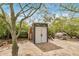 Exterior view of a shed with tan and brown siding, perfect for storage and tools at 33852 N 52Nd St, Cave Creek, AZ 85331