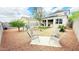 Relaxing desert landscaped backyard with outdoor seating and covered patio at 3402 N 300Th Dr, Buckeye, AZ 85396