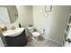 Charming powder room boasts a modern vanity, decorative mirrors, and neutral tones at 3402 N 300Th Dr, Buckeye, AZ 85396