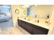 Bathroom boasts dual sinks and a large vanity with modern fixtures and decor at 3402 N 300Th Dr, Buckeye, AZ 85396