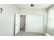 Bright bedroom featuring neutral walls, carpet floors, closet with sliding doors, and white trim at 3402 N 300Th Dr, Buckeye, AZ 85396