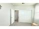 Bedroom features gray carpet, a white dresser, and a closet with sliding doors, creating a modern space at 3402 N 300Th Dr, Buckeye, AZ 85396