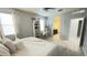 Bright bedroom featuring plank flooring, a ceiling fan, and plenty of natural light at 3402 N 300Th Dr, Buckeye, AZ 85396