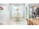 Cozy dining area with modern lighting fixture and large window at 3402 N 300Th Dr, Buckeye, AZ 85396